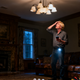 Man troubleshooting a light that suddenly stops working, using light troubleshooting safety tips.