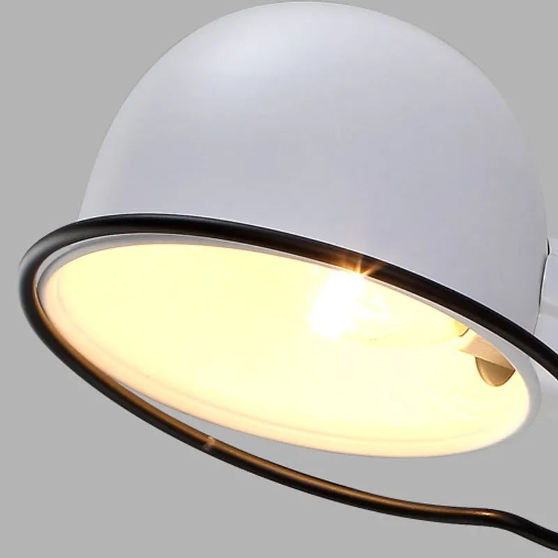 Close-up of a white light fixture with a glowing bulb, illustrating how to clean light fixtures for a brighter home.