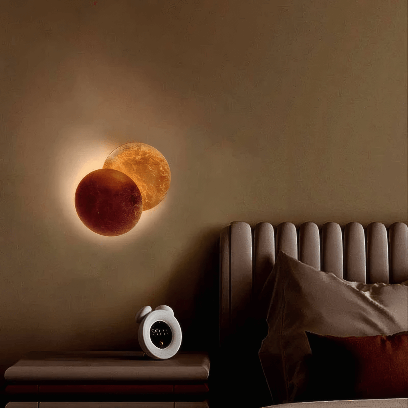 Modern kids room lighting ideas with planet-shaped wall lamps on beige wall beside bed.